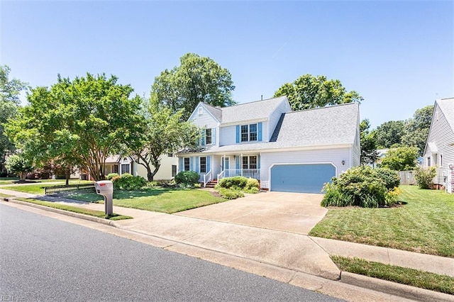 13 Fawn Cir, Hampton, VA 23666 - traditional home featuring a garage, a porch, concrete driveway, and a front lawn