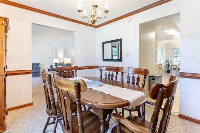 13 Fawn Cir, Hampton, VA 23666 - dining area featuring light carpet, a chandelier, and ornamental molding