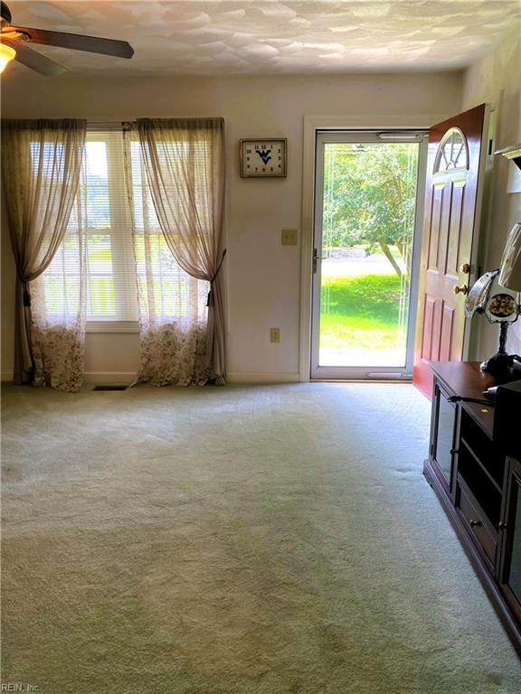 2016 Kilby Ln, Suffolk, VA 23434 - living room featuring healthy amount of natural light, ceiling fan, and carpet