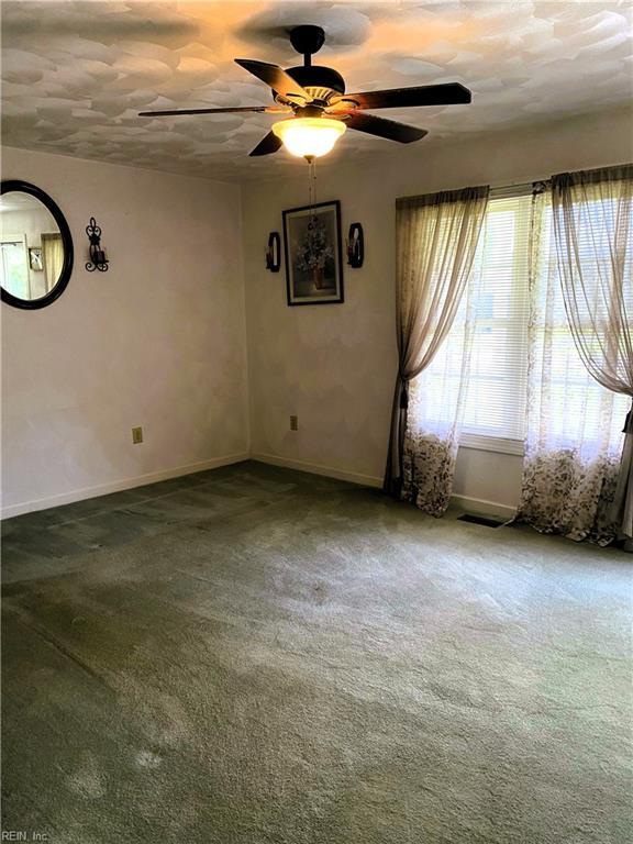 2016 Kilby Ln, Suffolk, VA 23434 - carpeted spare room with baseboards and a ceiling fan