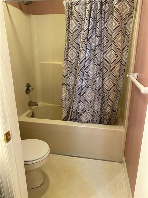 2016 Kilby Ln, Suffolk, VA 23434 - full bathroom featuring shower / bathtub combination with curtain and tile patterned floors