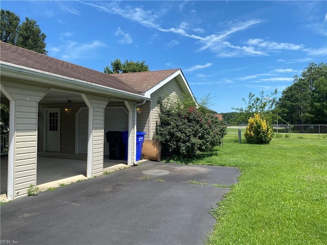 2016 Kilby Ln, Suffolk, VA 23434 - view of side of home featuring roof with shingles and an attached garage