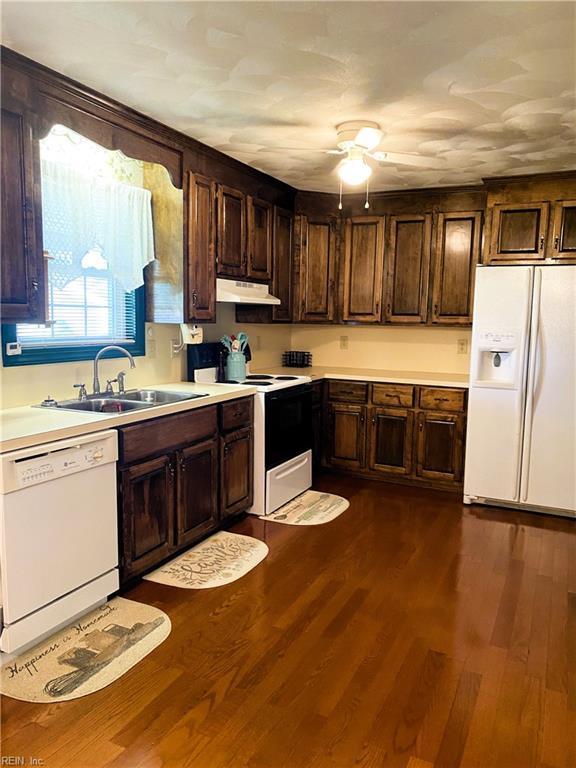 2016 Kilby Ln, Suffolk, VA 23434 - kitchen featuring white appliances, under cabinet range hood, a ceiling fan, and light countertops