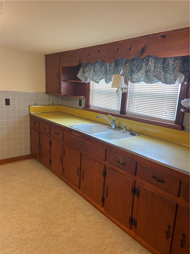 23 Forrest Dr, Newport News, VA 23606 - kitchen with light countertops, open shelves, tile walls, and brown cabinets