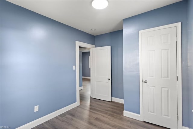 3033 Williams St, Newport News, VA 23607 - unfurnished bedroom with baseboards and wood finished floors