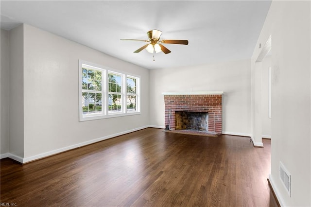 2822 Beachmont Ave, Norfolk, VA 23504 - unfurnished living room featuring dark wood-style floors, a ceiling fan, and a fireplace