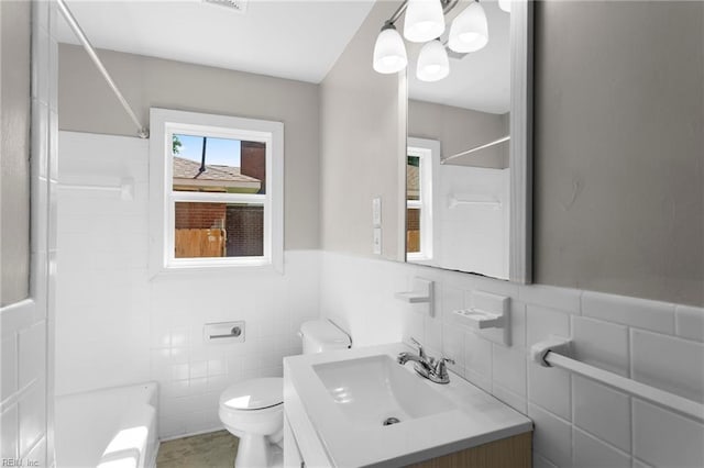 2822 Beachmont Ave, Norfolk, VA 23504 - full bathroom featuring tile walls, vanity, a chandelier, a wainscoted wall, and bathing tub / shower combination