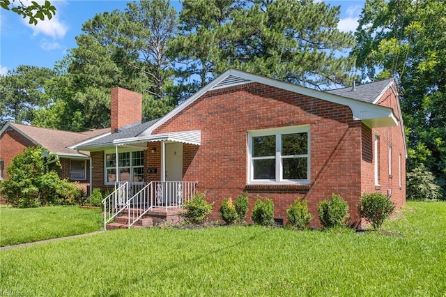 2822 Beachmont Ave, Norfolk, VA 23504 - view of front of property featuring brick siding, a front lawn, and a chimney