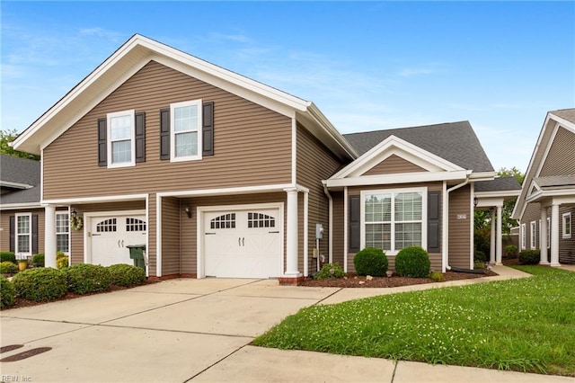 2816 Gavin Rd Unit 14, Chesapeake, VA 23323 - view of front of house featuring a garage, concrete driveway, and a front lawn