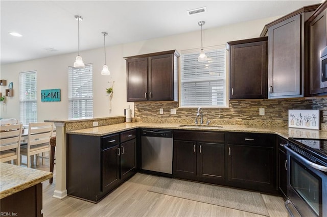 2816 Gavin Rd Unit 14, Chesapeake, VA 23323 - kitchen featuring dishwasher, range with electric cooktop, light wood-style floors, a peninsula, and backsplash