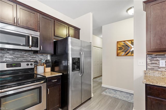 2816 Gavin Rd Unit 14, Chesapeake, VA 23323 - kitchen featuring appliances with stainless steel finishes, light wood finished floors, backsplash, light stone countertops, and dark brown cabinetry
