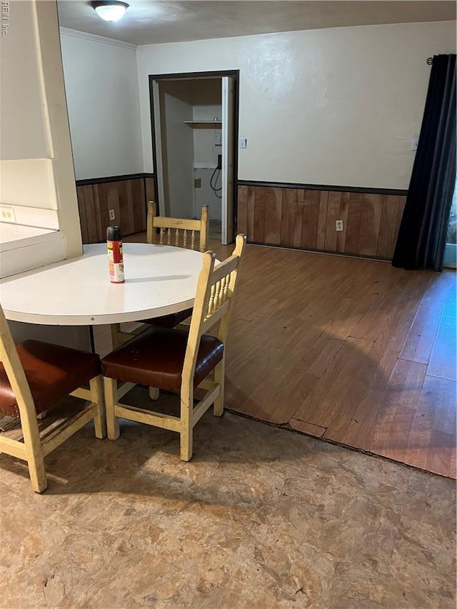 5721 E Hastings Arch, Virginia Beach, VA 23462 - dining space featuring a wainscoted wall, wood finished floors, and wood walls