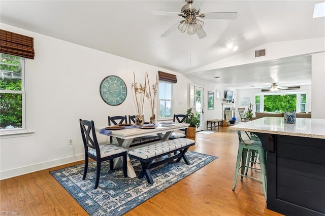 682 Bay Port Rd, Jamaica, VA 23079 - dining area featuring vaulted ceiling, a ceiling fan, and light wood-style floors