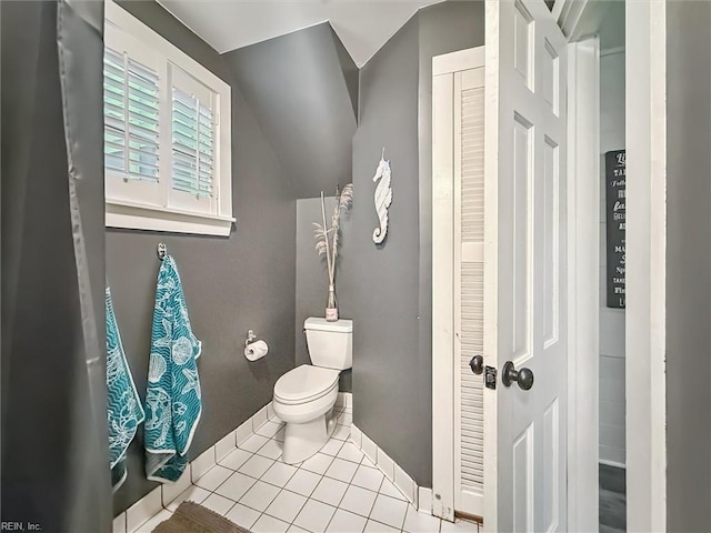 682 Bay Port Rd, Jamaica, VA 23079 - bathroom featuring tile patterned flooring, lofted ceiling, and a closet