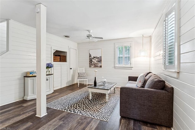 682 Bay Port Rd, Jamaica, VA 23079 - living area featuring a ceiling fan, dark wood finished floors, and wood walls
