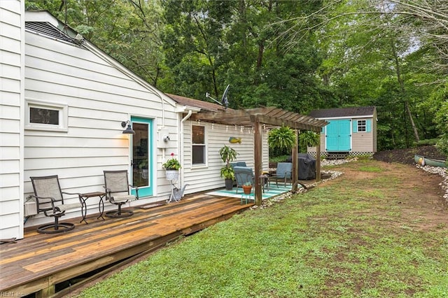 682 Bay Port Rd, Jamaica, VA 23079 - view of green lawn with a pergola, a storage shed, and a wooden deck