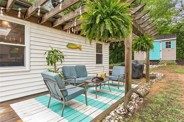 682 Bay Port Rd, Jamaica, VA 23079 - wooden terrace with an outdoor hangout area, a shed, and grilling area