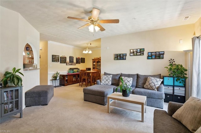 903 Rustads Cir, Williamsburg, VA 23188 - carpeted living area with a ceiling fan, a chandelier, and ornamental molding