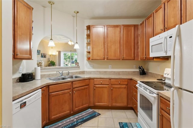 903 Rustads Cir, Williamsburg, VA 23188 - kitchen with white appliances, light countertops, light tile patterned flooring, brown cabinetry, and decorative light fixtures