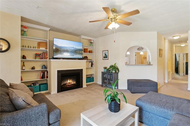 903 Rustads Cir, Williamsburg, VA 23188 - living room featuring carpet flooring, ceiling fan, and a warm lit fireplace