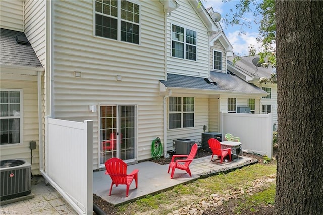 903 Rustads Cir, Williamsburg, VA 23188 - back of house with a patio area and roof with shingles