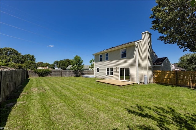 3809 Hazel Ct, Virginia Beach, VA 23456 - rear view of property featuring a chimney, a fenced backyard, and a deck