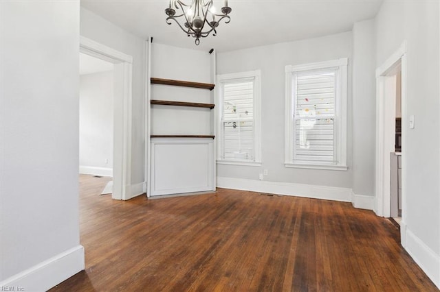 1145 24th St, Newport News, VA 23607 - unfurnished dining area with a chandelier and wood finished floors