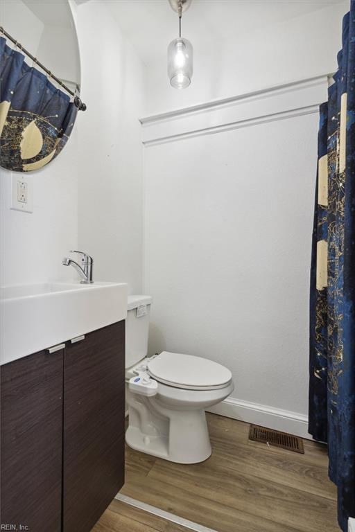 1145 24th St, Newport News, VA 23607 - bathroom with vanity and wood finished floors