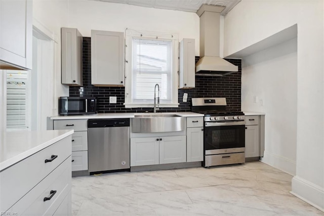 1145 24th St, Newport News, VA 23607 - kitchen with stainless steel appliances, custom range hood, light marble finish flooring, light countertops, and decorative backsplash