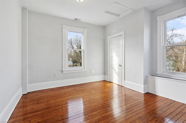 1145 24th St, Newport News, VA 23607 - unfurnished room with attic access and hardwood / wood-style floors