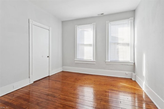 1145 24th St, Newport News, VA 23607 - unfurnished bedroom featuring wood-type flooring and baseboards