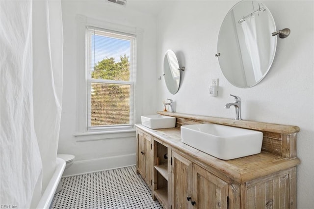 1145 24th St, Newport News, VA 23607 - bathroom featuring tile patterned floors and double vanity