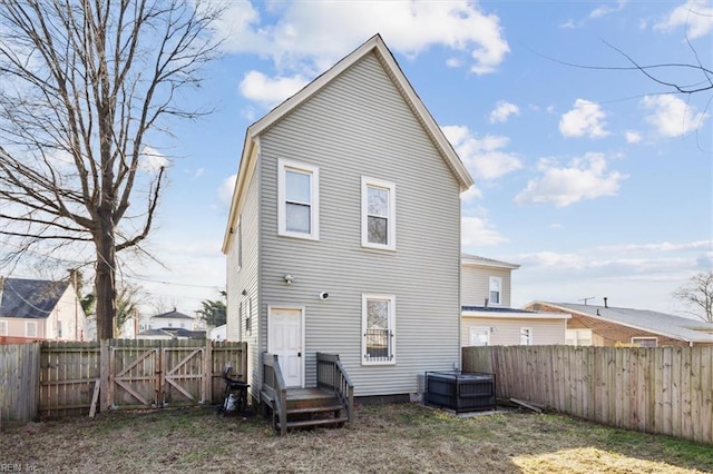 1145 24th St, Newport News, VA 23607 - rear view of property featuring a fenced backyard and a gate