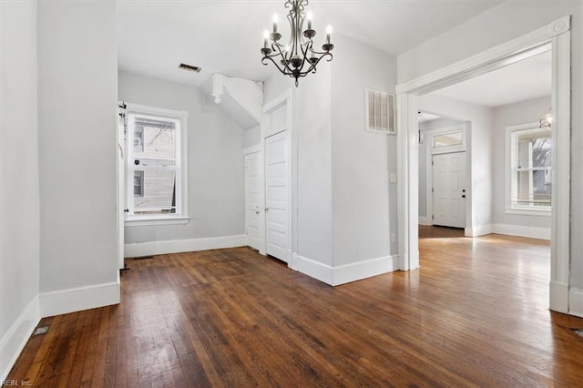 1145 24th St, Newport News, VA 23607 - unfurnished dining area with a chandelier and wood finished floors