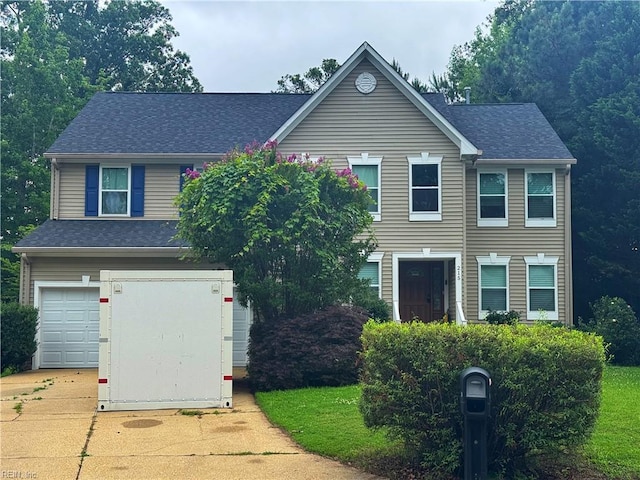 215 Erin Leigh Cir, Newport News, VA 23602 - traditional home with driveway, a garage, and a shingled roof