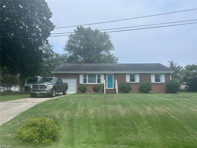 905 Magruder Rd, Smithfield, VA 23430 - single story home featuring a garage, brick siding, a front yard, driveway, and entry steps