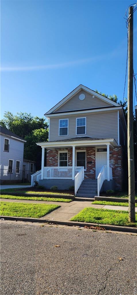 1126 24th St, Newport News, VA 23607 - view of front of house featuring a porch and brick siding