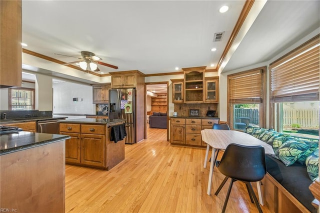 1628 Hawks Bill Dr, Virginia Beach, VA 23464 - kitchen featuring appliances with stainless steel finishes, plenty of natural light, brown cabinets, crown molding, and recessed lighting