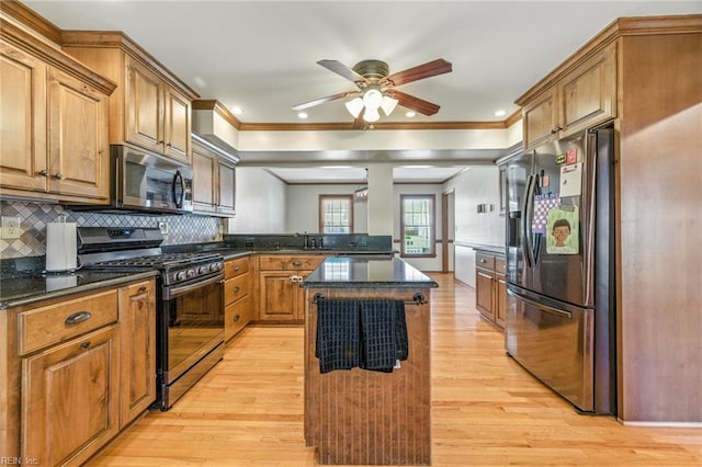 1628 Hawks Bill Dr, Virginia Beach, VA 23464 - kitchen with stainless steel appliances, light wood-style flooring, ornamental molding, and ceiling fan