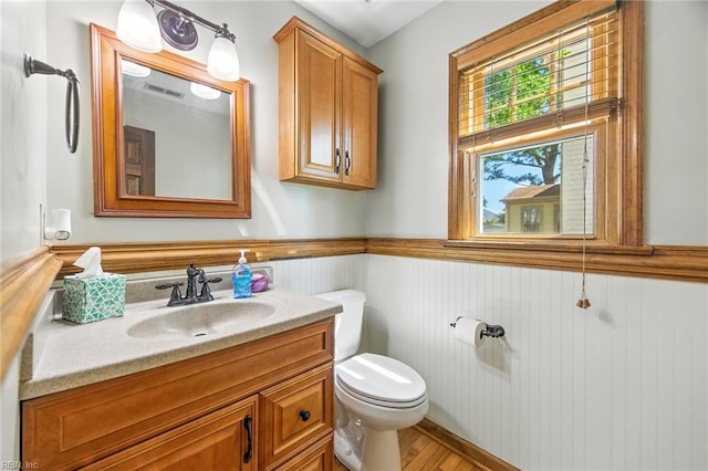 1628 Hawks Bill Dr, Virginia Beach, VA 23464 - half bathroom featuring vanity, wood finished floors, and wainscoting