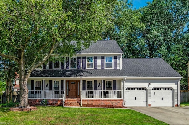 1628 Hawks Bill Dr, Virginia Beach, VA 23464 - colonial home featuring a garage, driveway, covered porch, and roof with shingles