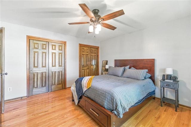 1628 Hawks Bill Dr, Virginia Beach, VA 23464 - bedroom with light wood finished floors, ceiling fan, and two closets