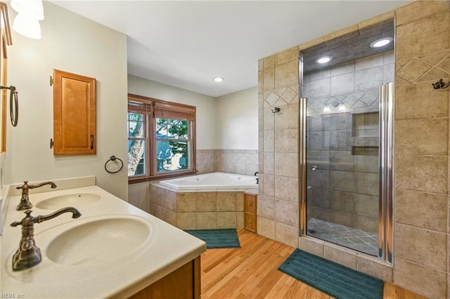 1628 Hawks Bill Dr, Virginia Beach, VA 23464 - bathroom with wood finished floors, a shower stall, a bath, double vanity, and recessed lighting