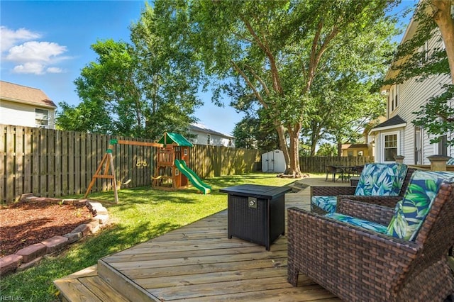 1628 Hawks Bill Dr, Virginia Beach, VA 23464 - wooden terrace featuring a storage shed, a playground, a fenced backyard, and outdoor dining space