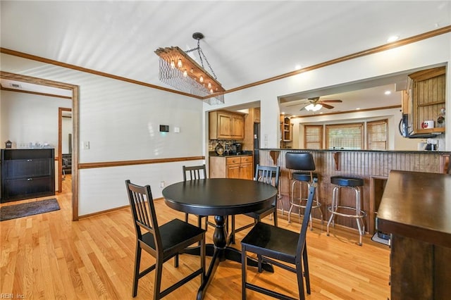1628 Hawks Bill Dr, Virginia Beach, VA 23464 - dining space featuring crown molding, light wood-style flooring, ceiling fan, and vaulted ceiling