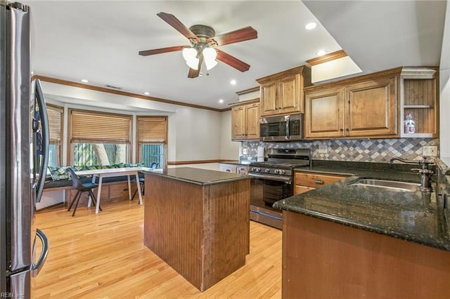 1628 Hawks Bill Dr, Virginia Beach, VA 23464 - kitchen featuring stainless steel appliances, crown molding, a kitchen island, light wood-style floors, and a ceiling fan