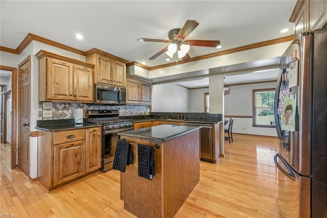 1628 Hawks Bill Dr, Virginia Beach, VA 23464 - kitchen featuring appliances with stainless steel finishes, light wood finished floors, ornamental molding, a center island, and recessed lighting