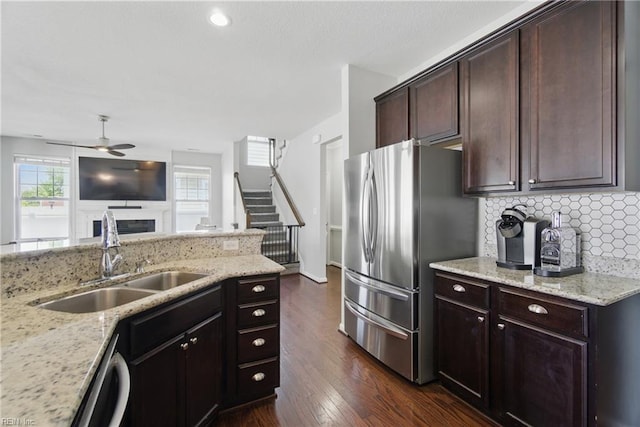 2137 Bellflower Way, Chesapeake, VA 23323 - kitchen featuring appliances with stainless steel finishes, a ceiling fan, backsplash, dark wood finished floors, and light stone countertops