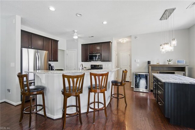 2137 Bellflower Way, Chesapeake, VA 23323 - kitchen featuring stainless steel appliances, a spacious island, ceiling fan, a kitchen breakfast bar, and recessed lighting
