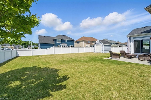2137 Bellflower Way, Chesapeake, VA 23323 - fenced backyard with a storage unit, a patio, and a residential view